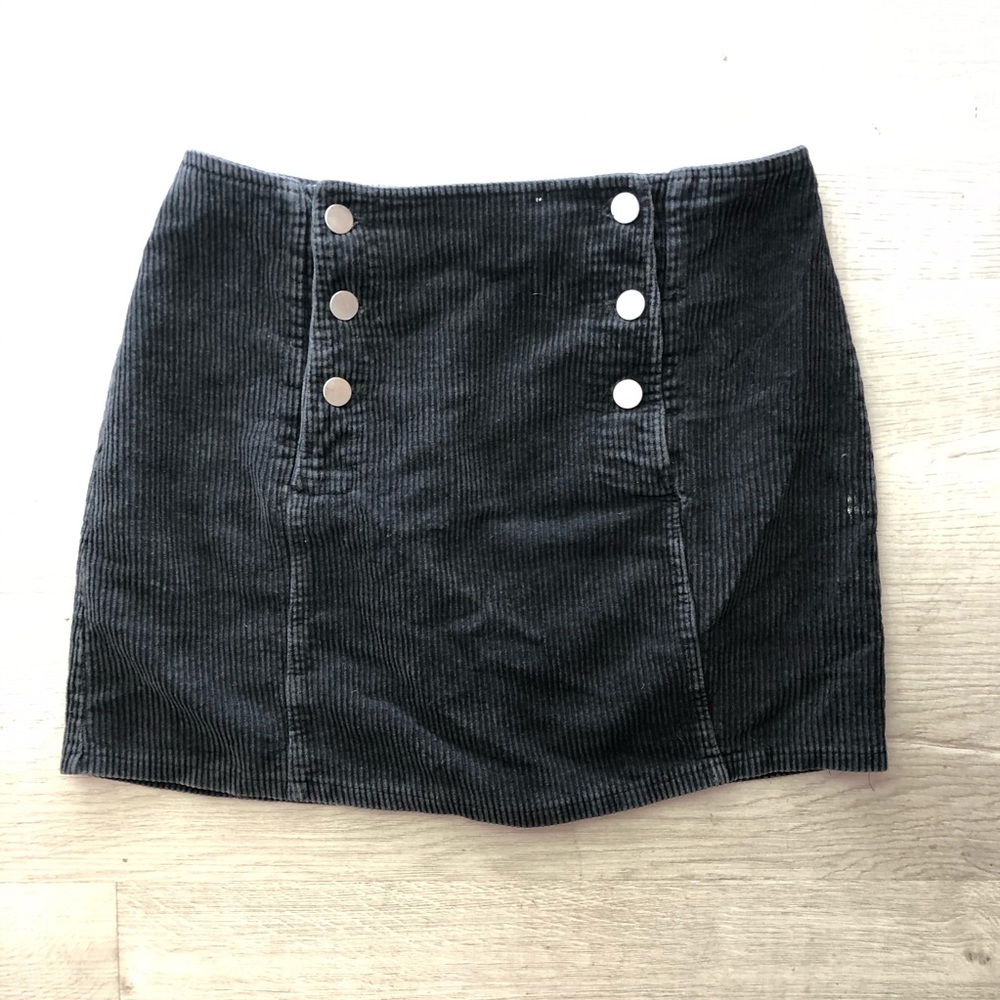 Black corduroy skirt with silver buttons. Vintage